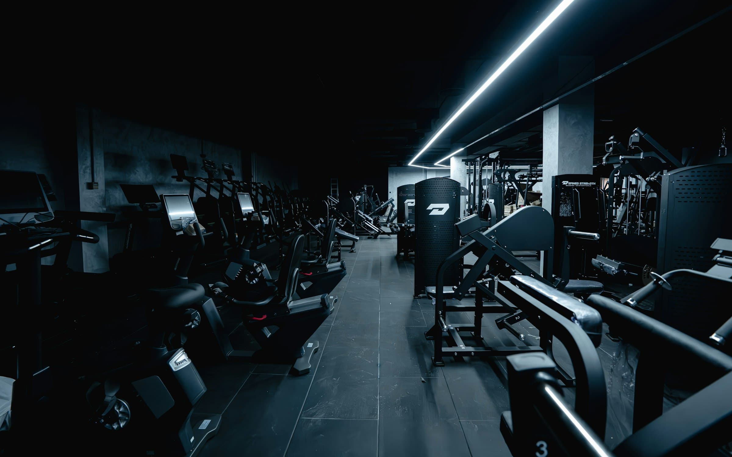 ELITE24 gym floor lined with strength and cardio equipment